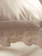 Close-up of scalloped eyelet ruffle and cotton lace trim on the Chantilly pillowcase