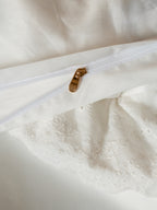 Hidden gold zipper closure on the Crème layered ruffle duvet cover