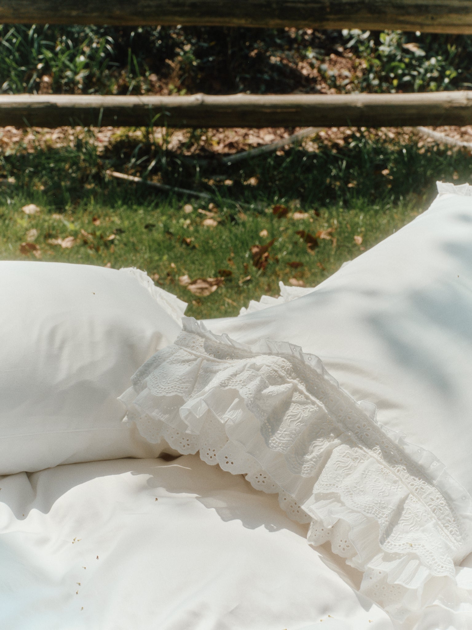 Close-up of Crème collection bedding with layered ruffle detail